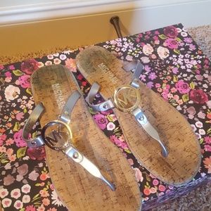 Silver and tan Michael Kors flip flops